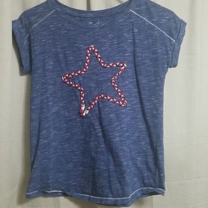 Blue shirt with red and white woven star